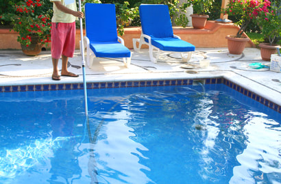 This is a picture of our staff cleaning a pool in Amarillo, Texas.
